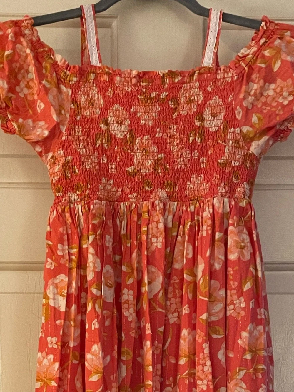 Girls coral floral dress Haute Hippie w/ a smocked bodice, puff sleeve…